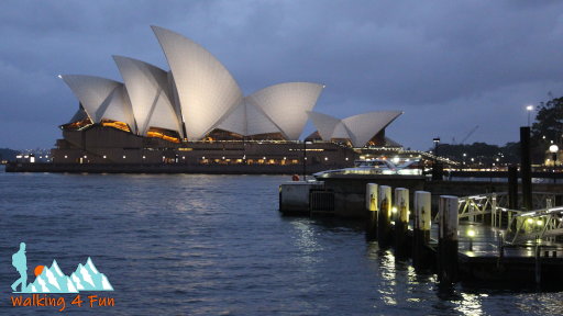 Sydney Opera House lit up with lights at dusk