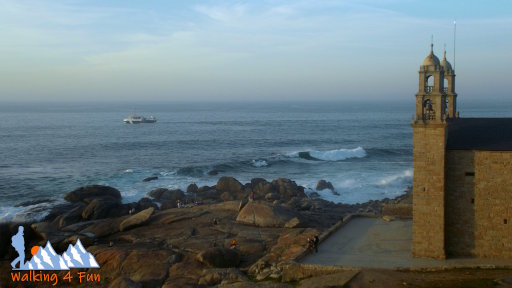 Church with waves crashing on a nearby seashore.