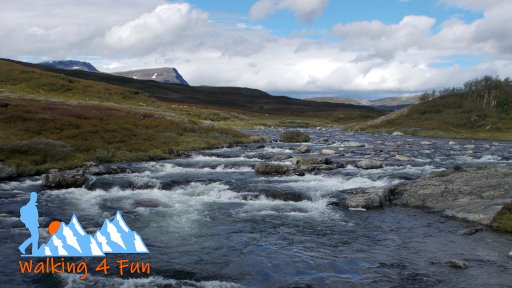 Wide, shallow river with a few small rapids