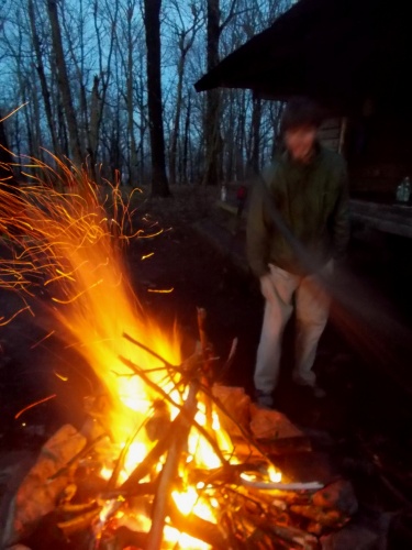 Superman builds a campfire