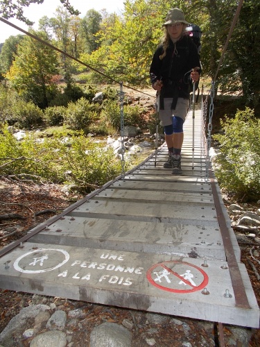 Karolina crosses a suspension bridge